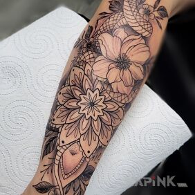 Tattoo Snake Tattoo Flowers Mandala on the forearm motif: black and gray style: graphic / illustrative