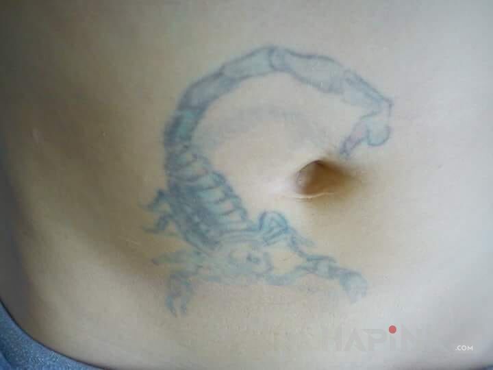 Tattoo Skorpion in zodiac signs motif on the stomach