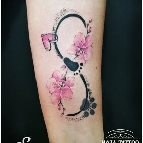 Tattoo Infinity symbol on the forearm motif: colorful style: graphic / illustrative
