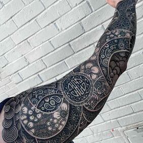 Tattoo Interesting mix on the forearm motif: flowers style: graphic / illustrative