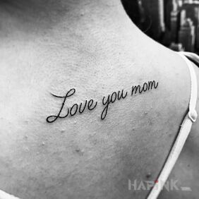 Tattoo I love you mom on the collarbone motif: lettering style: calligraphy