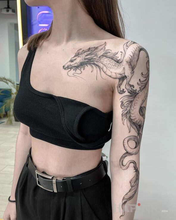 Tattoo Mistyczny smok in fantasy motif and graphic / illustrative style On the arm