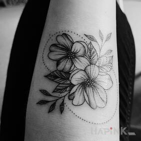 Tattoo Second tattoo. Floral theme. On the arm motif: flowers style: graphic / illustrative