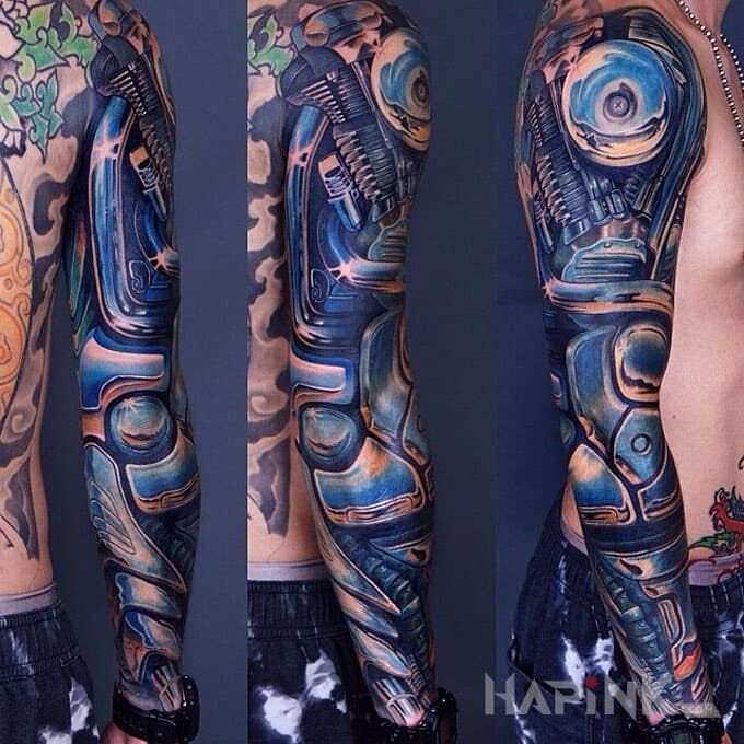 Tattoo Harley Davidson in 3D motif and biomechanics style On the arm