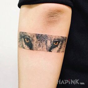 Tattoo Wolf eyes on the forearm motif: animals style: realistic