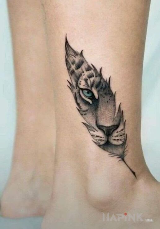 Tattoo Tygrys w piorku in black and gray motif and realistic style near the ankle