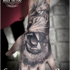 Tattoo Lion, cover on the hand motif: animals style: realistic