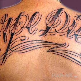 Tattoo Carpe Diem on the back motif: lettering