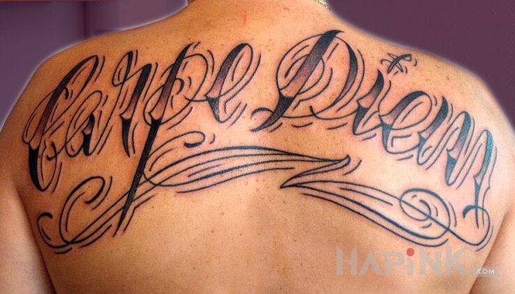 Tattoo Carpe Diem in lettering motif on the back