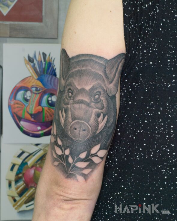 Tattoo Dziczyzna in black and gray motif and graphic / illustrative style On the arm
