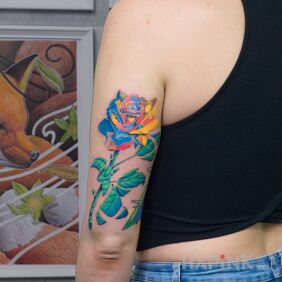 Tattoo Surrealist rose On the arm motif: colorful style: surrealistic