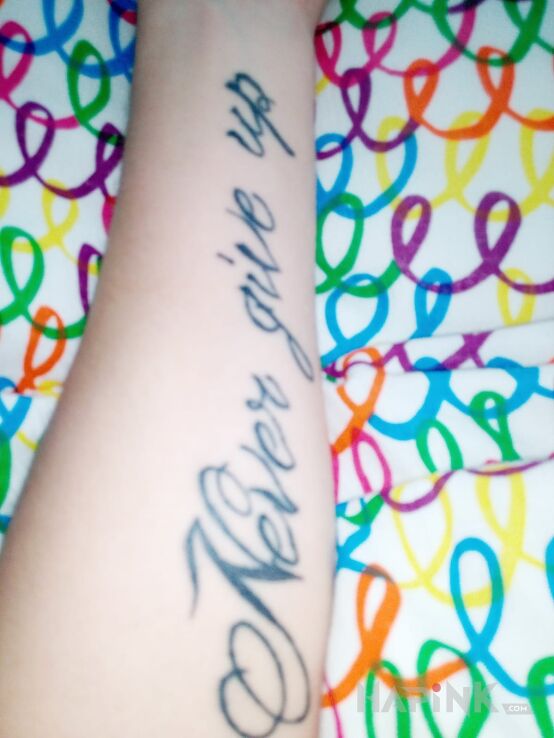 Tattoo Na 16 urodziny in lettering motif on the forearm