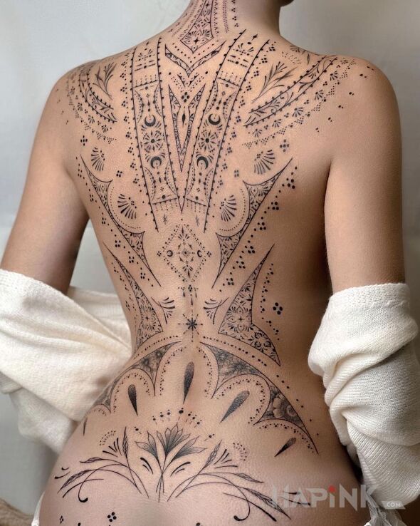 Tattoo Ornamentalnie in black and gray motif on the back