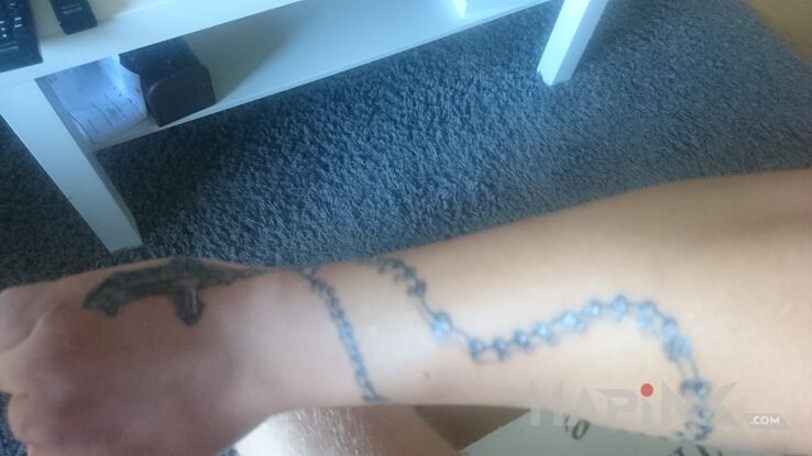 Tattoo Różaniec in angels motif on the wrist