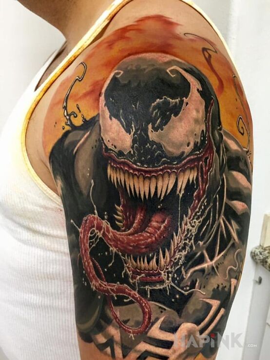 Tattoo Venom in characters motif on the upper arm