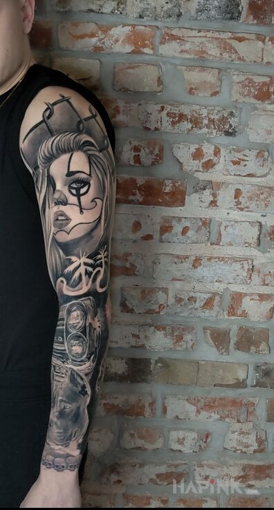 Tattoo Pół rękaw chciano in black and gray motif and chicano style on the upper arm