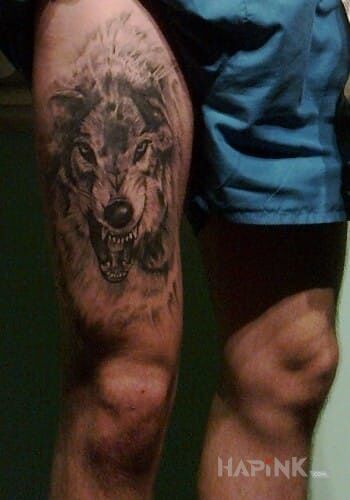 Tattoo Wilk, wolf in animals motif and realistic style on the leg