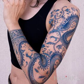Tattoo Beautiful blue dragon on the forearm motif: colorful style: japanese / irezumi