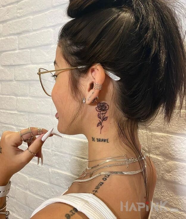 Tattoo Odważna róża in lettering motif and graphic / illustrative style on the neck