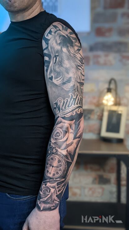 Tattoo Pół rękaw in black and gray motif and realistic style On the arm