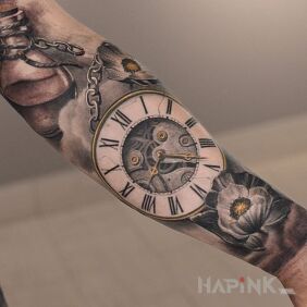Tattoo Pocket watch on the forearm motif: flowers style: realistic