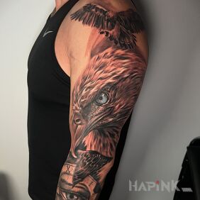 Tattoo Eagle on the upper arm motif: black and gray style: realistic
