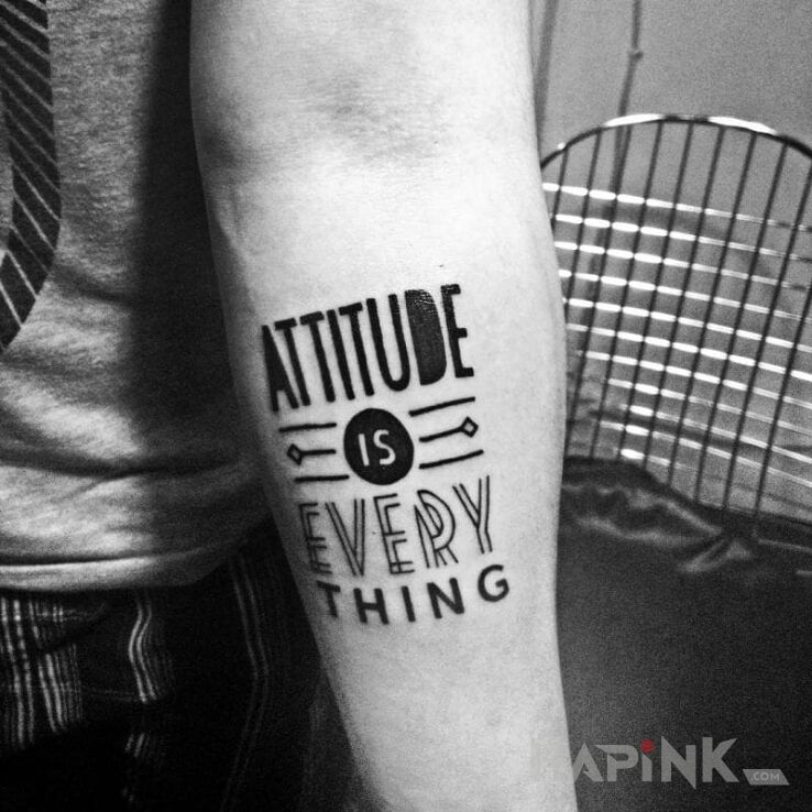 Tattoo Attitude is everything in lettering motif on the forearm