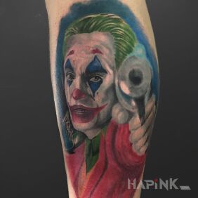 Tattoo Joker on the leg motif: characters style: realistic