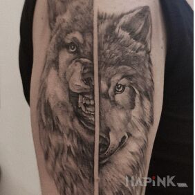 Tattoo Such a wolf - two faces On the arm motif: animals style: realistic