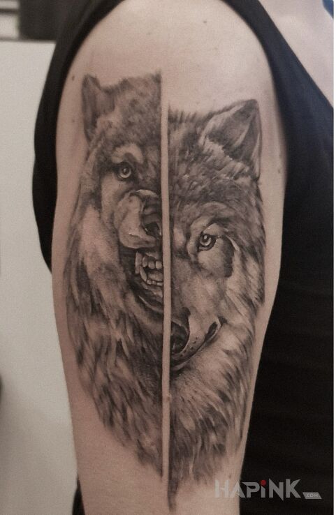 Tattoo Taki wilk- dwa oblicza in animals motif and realistic style On the arm