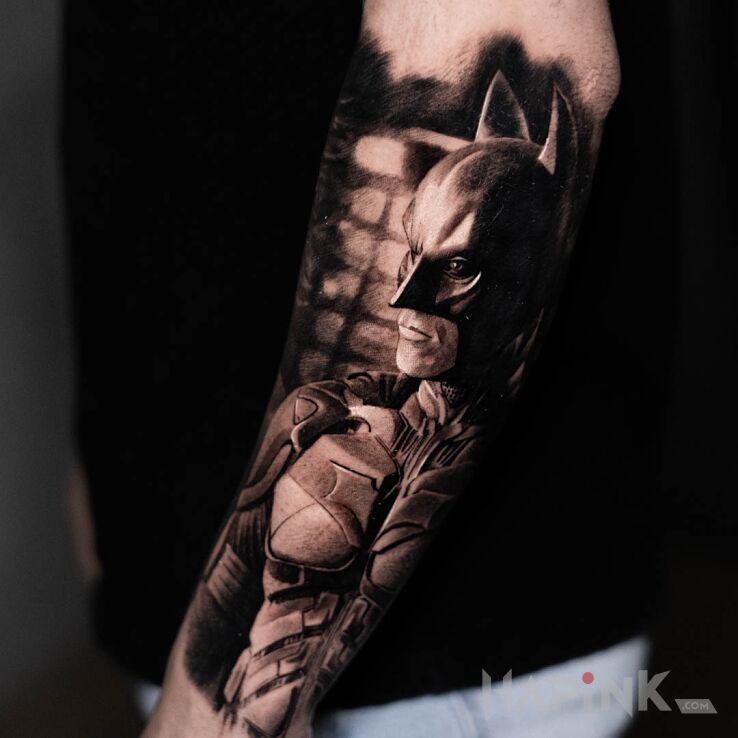 Tattoo Batman in dark motif and realistic style On the arm