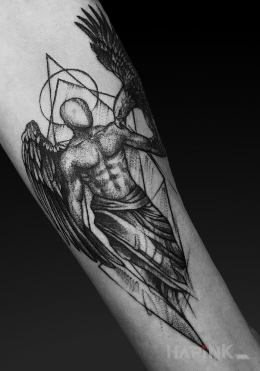 Tattoo Anioł - sketch in religious motif and graphic / illustrative style on the forearm