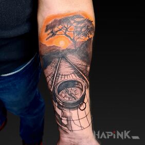 Tattoo African sunset on the forearm motif: nature style: realistic