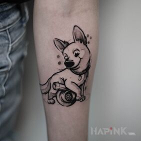 Tattoo Puppy On the arm motif: black and gray style: cartoon / comic book