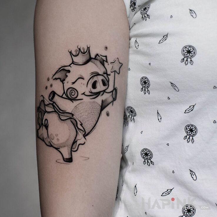 Tattoo Świnka in black and gray motif and cartoon / comic book style On the arm