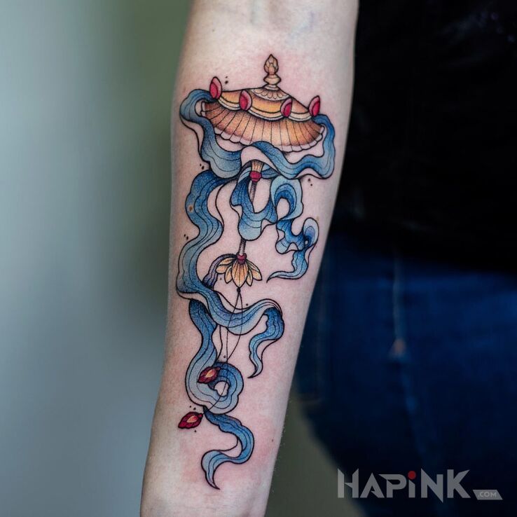 Tattoo Parasol in colorful motif and japanese / irezumi style on the forearm