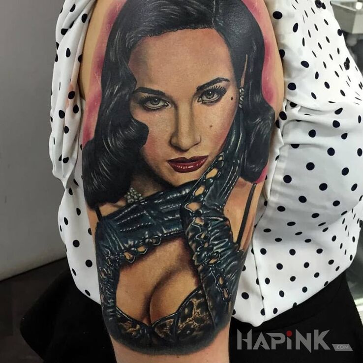Tattoo Dita Von Teese in sexy motif and realistic style on the upper arm