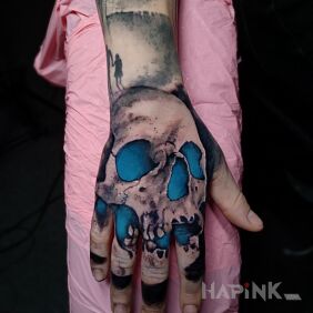 Tattoo Skull on the hand motif: colorful style: realistic