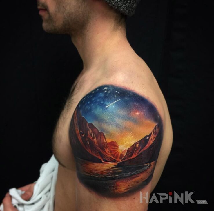 Tattoo Krajobraz in 3D motif and realistic style on the upper arm
