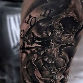 Tattoo Clock and skull on the upper arm motif: skulls style: realistic