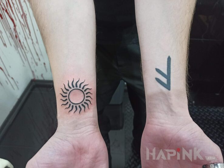 Tattoo Runy in religious motif and Celtic / Nordic style On the arm