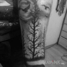 Tattoo Dark Forest on the forearm motif: animals
