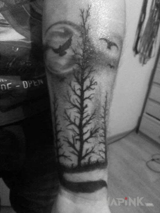 Tattoo Dark Forest in animals motif on the forearm