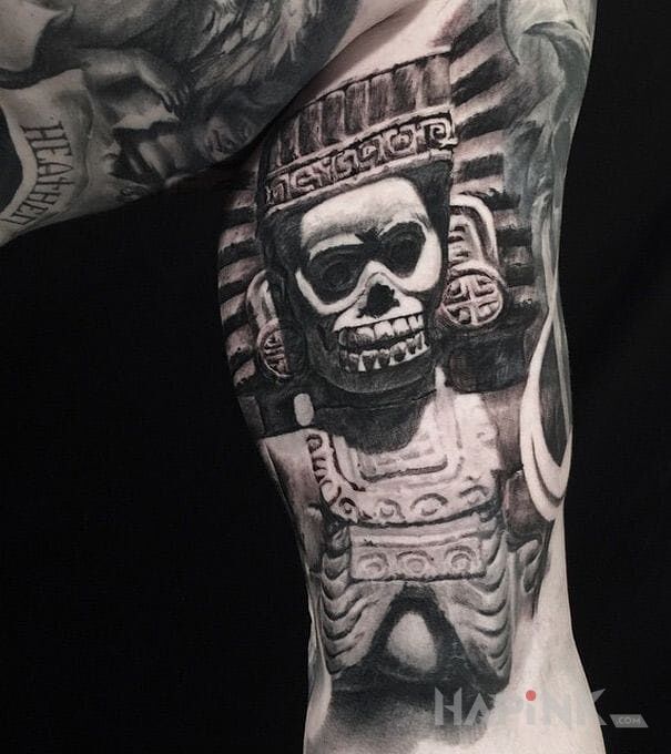 Tattoo Bóg śmierci in 3D motif and realistic style on the upper arm