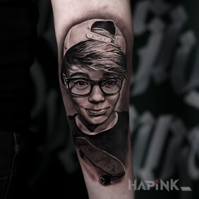 Tattoo Realistic child portrait On the arm motif: 3D style: realistic