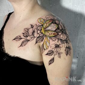 Tattoo Colorful beetle on flowers on the shoulder motif: colorful style: graphic / illustrative