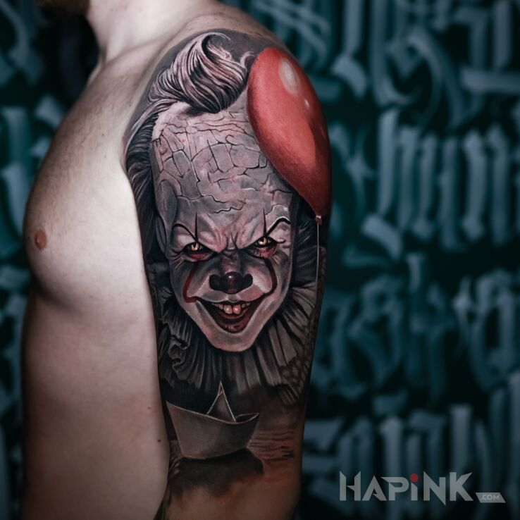 Tattoo Pennywise z balonikiem in dark motif and realistic style On the arm