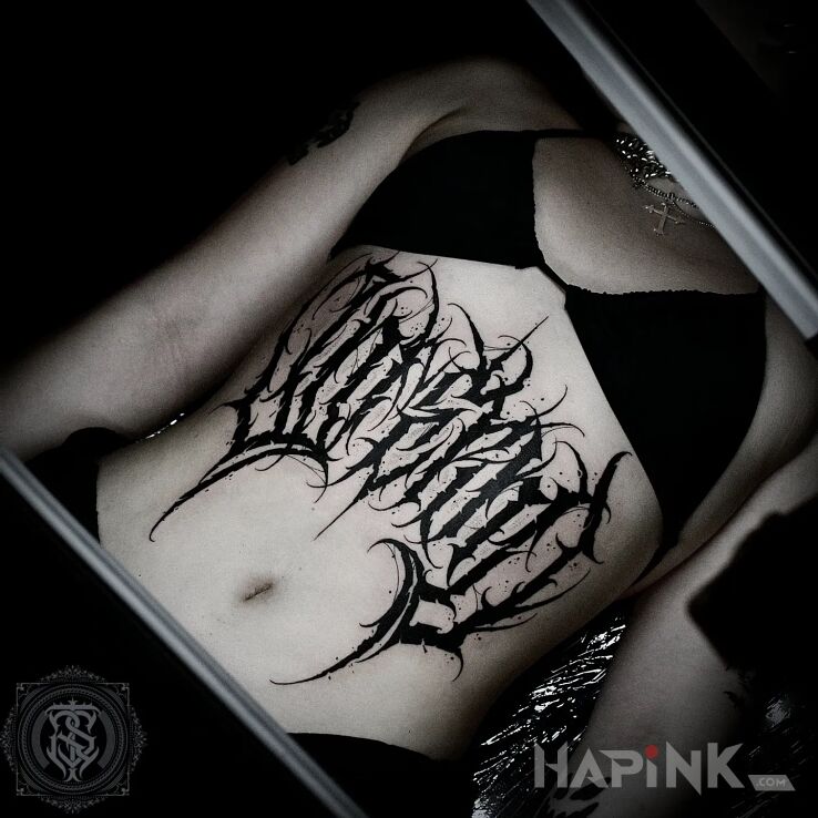 Tattoo Kaligrafia in black and gray motif and blackwork / blackout style on the stomach