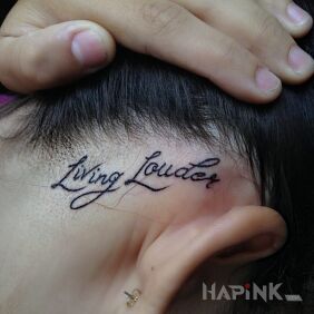 Tattoo Living Louder on the head motif: lettering