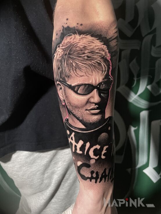 Tattoo Alice in Chains in lettering motif and realistic style on the forearm